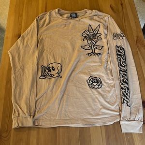 Zumiez Long Sleeve Tee, size medium. tan colored with some fun drawings